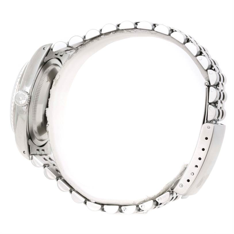 The image shows a side view of a Rolex Datejust 16234 Men's Stainless Steel Silver Dial 16234 Men's Stainless Steel Silver Dial watch, capturing the crown, case, and bracelet with a clasp.