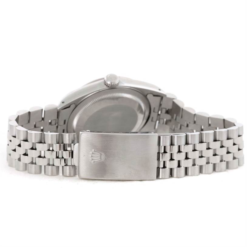 This image shows the back of a Rolex Datejust 16234 Men's Stainless Steel Silver Dial 16234 Men's Stainless Steel Silver Dial watch and its metal bracelet, with the clasp prominently displayed.