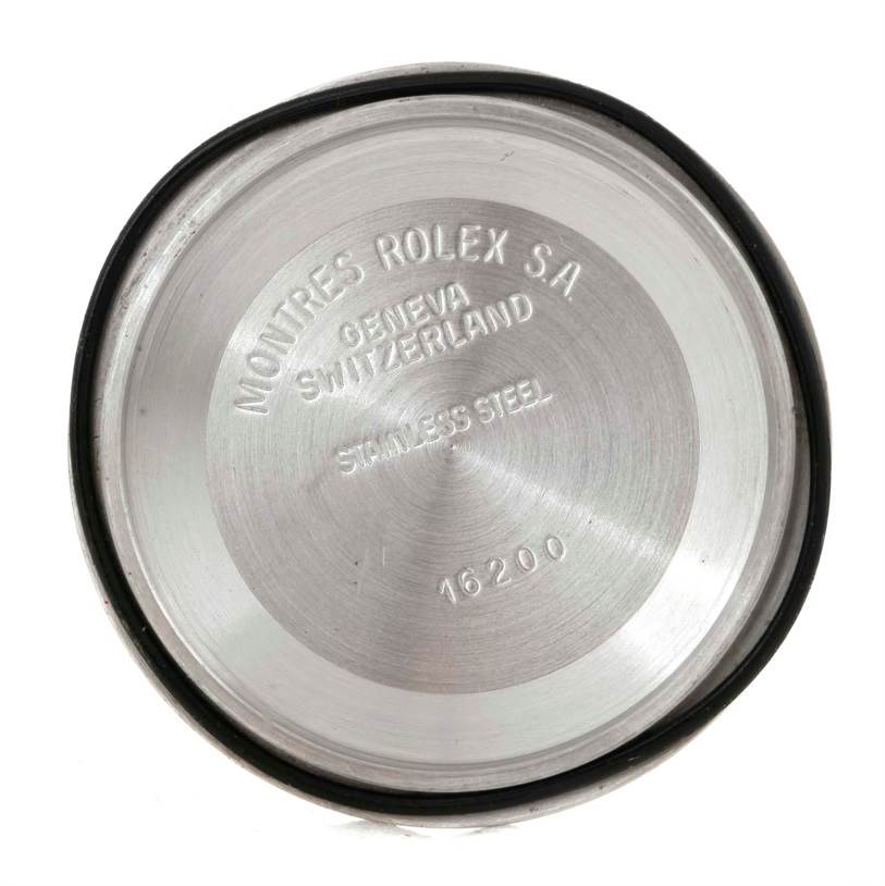 This image shows the inside case back of a Rolex Datejust 16220 Men's Stainless Steel Beige Dial 16220 Men's Stainless Steel Beige Dial model watch, displaying the brand engraving.