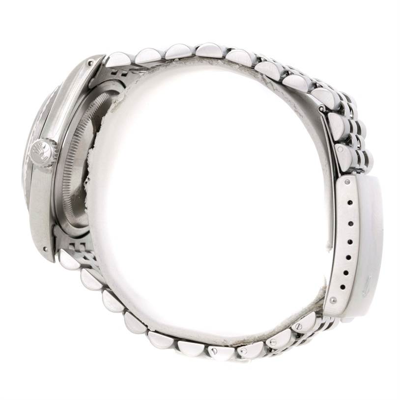 The Rolex Datejust 16220 Men's Stainless Steel Beige Dial 16220 Men's Stainless Steel Beige Dial watch is shown from a side angle, displaying the case, crown, and part of the bracelet.