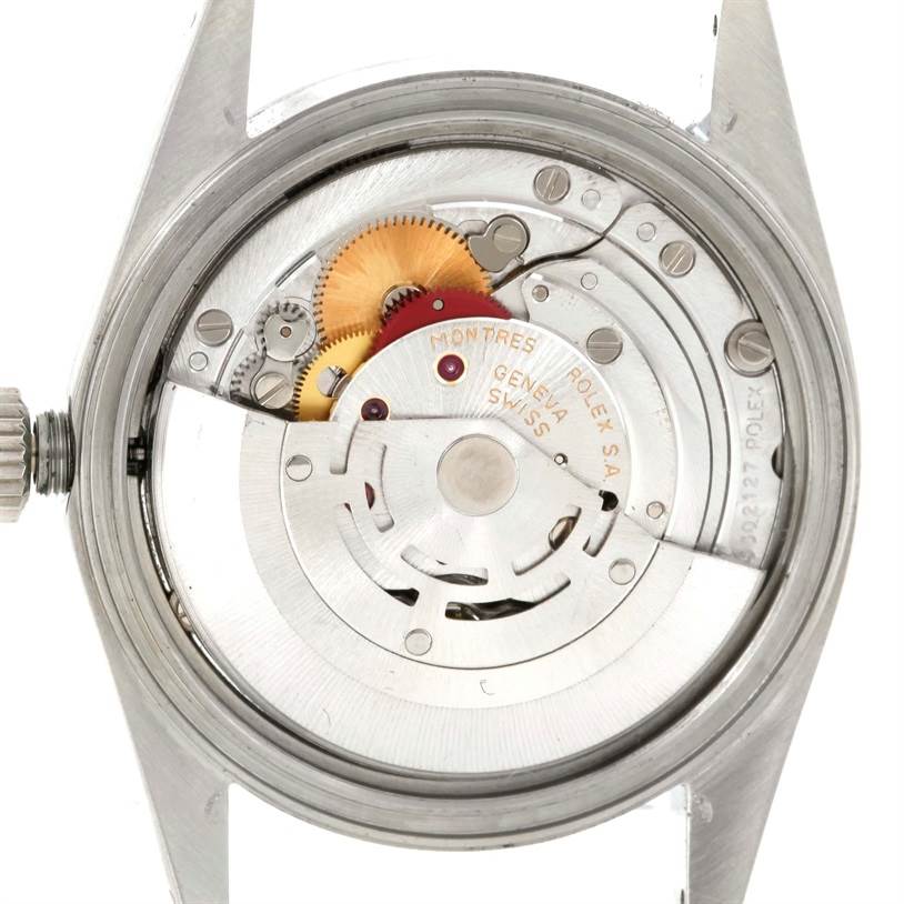 This is a close-up shot of the back of a Rolex Datejust 16220 Men's Stainless Steel Beige Dial 16220 Men's Stainless Steel Beige Dial watch, showing its intricate internal mechanism.