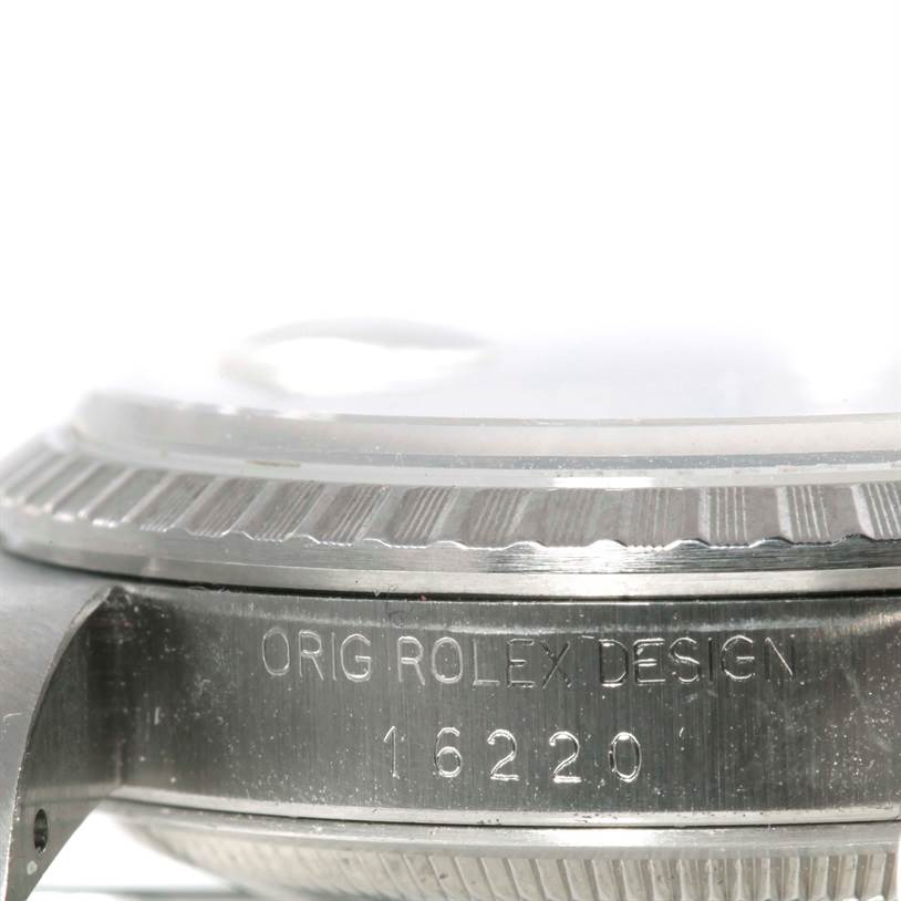 The image shows a side angle of a Rolex Datejust 16220 Men's Stainless Steel Beige Dial 16220 Men's Stainless Steel Beige Dial watch, highlighting the bezel, case, and model number 16220 engraving.