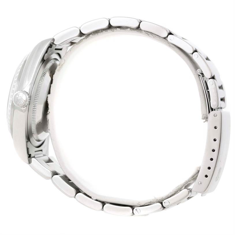 The image shows a side view of the Rolex Datejust 16220 Men's Stainless Steel Black Dial 16220 Men's Stainless Steel Black Dial model, highlighting the case, crown, and metal bracelet.