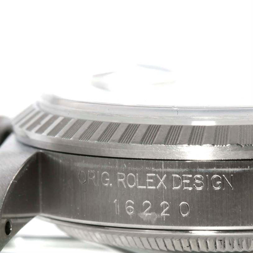 This image shows a close-up of the side of the Rolex Datejust 16220 Men's Stainless Steel Black Dial 16220 Men's Stainless Steel Black Dial, focusing on the case and bezel with the engraved model number 16220.