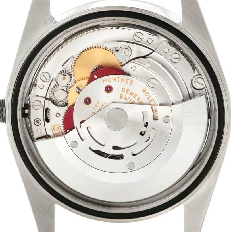 The image shows the internal mechanism of a Rolex Datejust 16220 Men's Stainless Steel Black Dial 16220 Men's Stainless Steel Black Dial watch from a back perspective, revealing its intricate gears and parts.