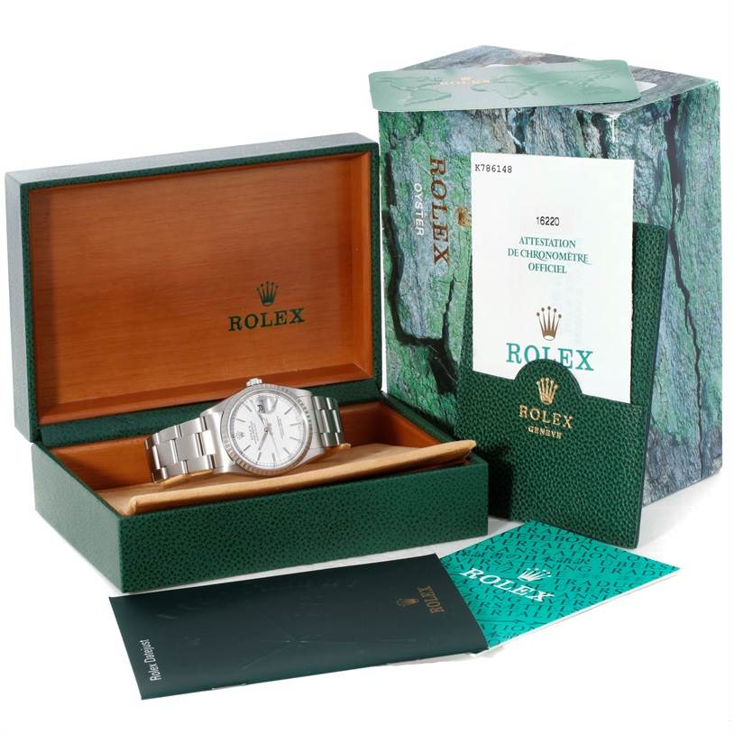 This image displays a Rolex Datejust 16220 Men's Stainless Steel Black Dial 16220 Men's Stainless Steel Black Dial watch in its box with the outer carton and accompanying documents.