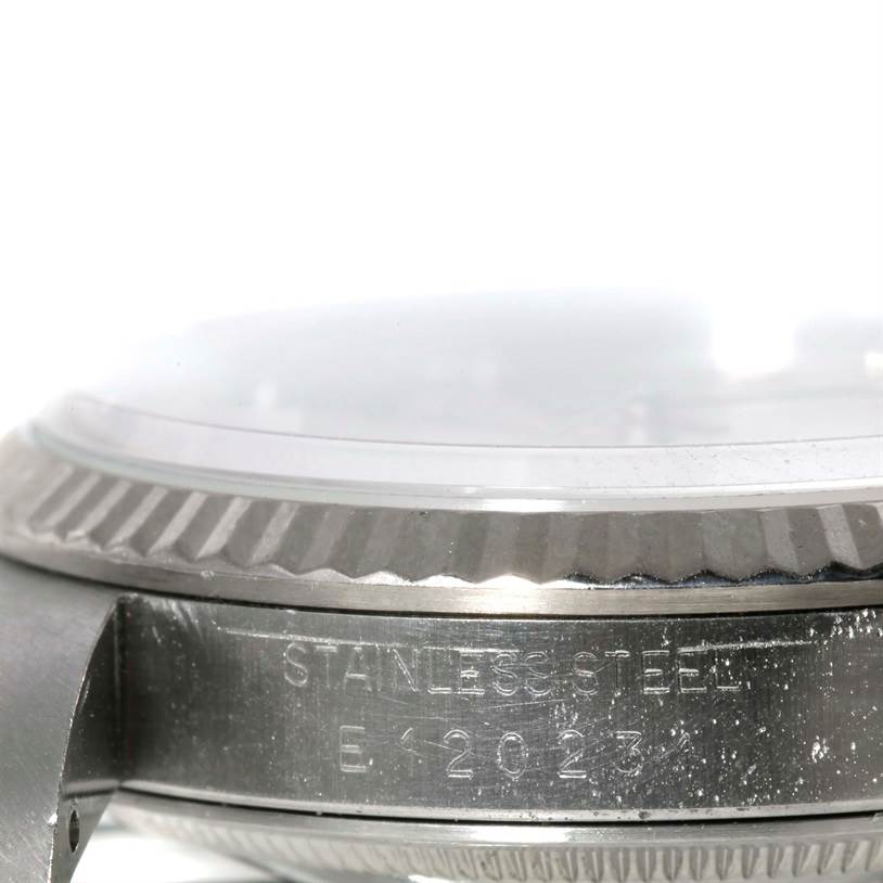 The image shows a close-up side view of the case and bezel of a Rolex Datejust 16234 Men's Stainless Steel Silver Dial 16234 Men's Stainless Steel Silver Dial watch, displaying part of its stainless steel and serial number.