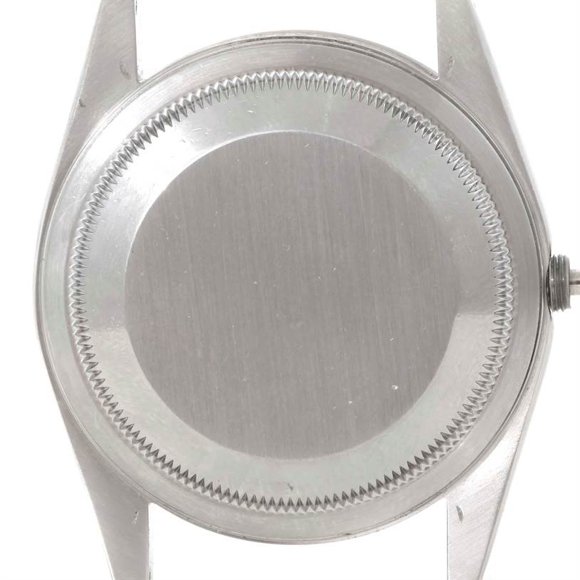 This image shows the back case of a Rolex Datejust 16234 Men's Stainless Steel Silver Dial 16234 Men's Stainless Steel Silver Dial watch taken from a top-down angle.