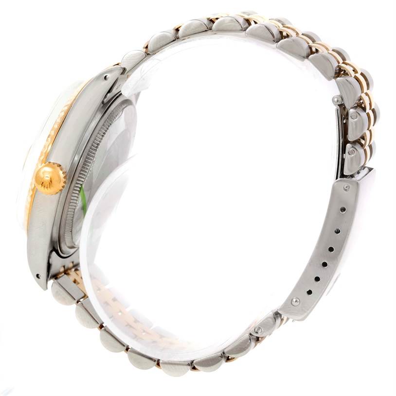 This image shows a side view of a Rolex Datejust 16013 Men's Stainless Steel Silver Dial 16013 Men's Stainless Steel Silver Dial watch with its bracelet, crown, and case visible.