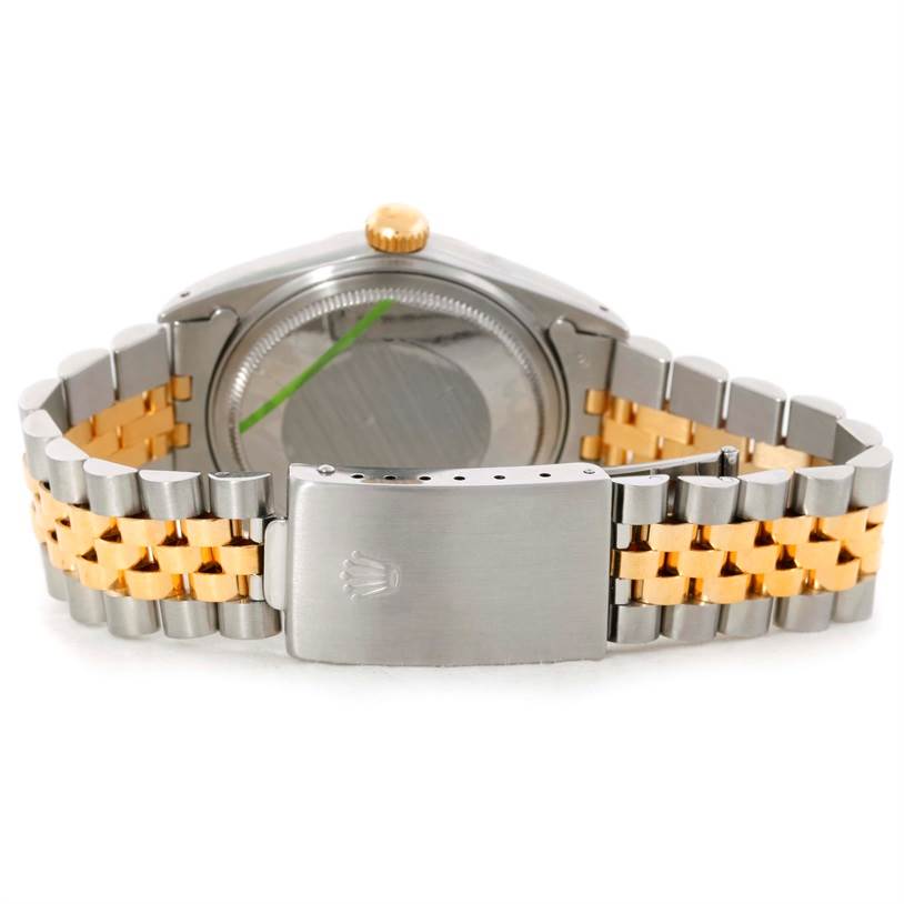 This image shows the back view of a Rolex Datejust 16013 Men's Stainless Steel Silver Dial 16013 Men's Stainless Steel Silver Dial watch, focusing on its clasp, bracelet, and caseback.