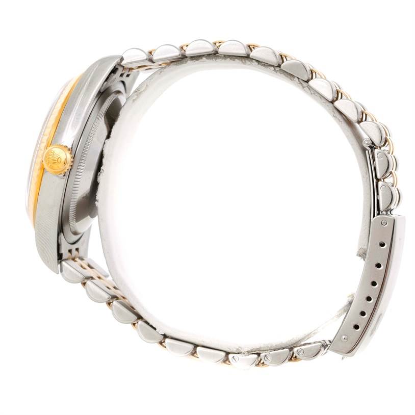 This image shows a side view of a Rolex Datejust 16233 Men's Steel and Gold (two tone) Silver Dial 16233 Men's Steel and Gold (two tone) Silver Dial watch, highlighting its bracelet, crown, and clasp.