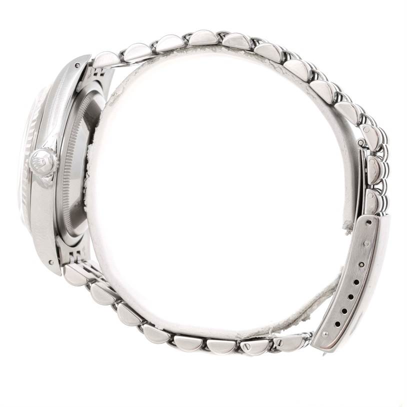 This image shows a side view of the dial, bracelet, and crown of a Rolex Datejust 16234 Men's Stainless Steel Silver Dial 16234 Men's Stainless Steel Silver Dial watch.