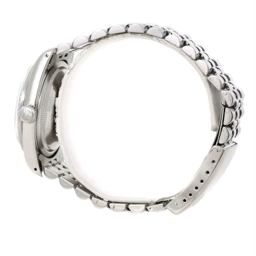 The photograph shows the side view of a Rolex Datejust 16220 Men's Stainless Steel Silver Dial 16220 Men's Stainless Steel Silver Dial watch, focusing on the bracelet and the side of the case.