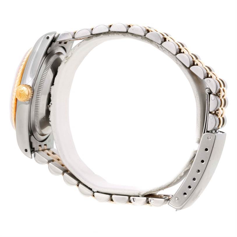 The Rolex Datejust 16233 Men's Steel and Gold (two tone) White Dial 16233 Men's Steel and Gold (two tone) White Dial watch is shown from a side angle, highlighting the crown, case, and bracelet.