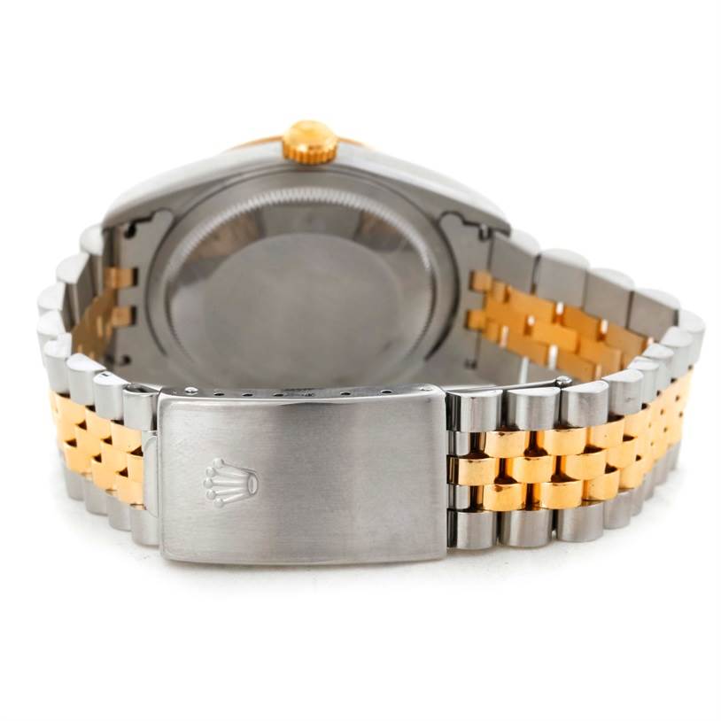 This image shows the back view of a Rolex Datejust 16233 Men's Steel and Gold (two tone) Champagne Dial 16233 Men's Steel and Gold (two tone) Champagne Dial watch, highlighting its stainless steel and gold bracelet with a clasp.