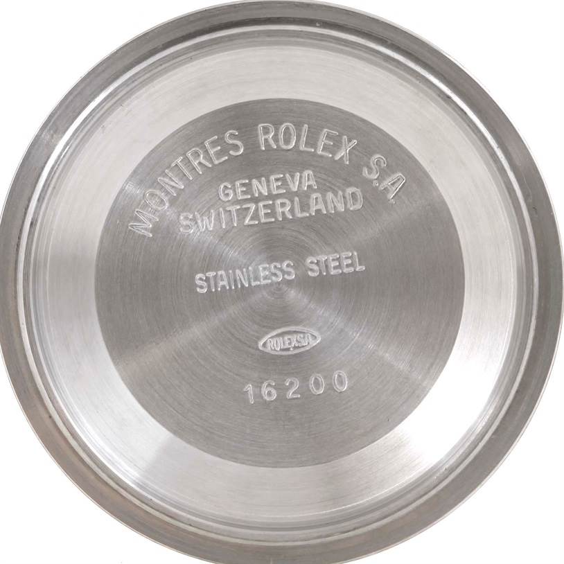 This image shows the inside of the stainless steel case back of a Rolex Datejust 16233 Men's Steel and Gold (two tone) Champagne Dial 16233 Men's Steel and Gold (two tone) Champagne Dial model, displaying engravings.