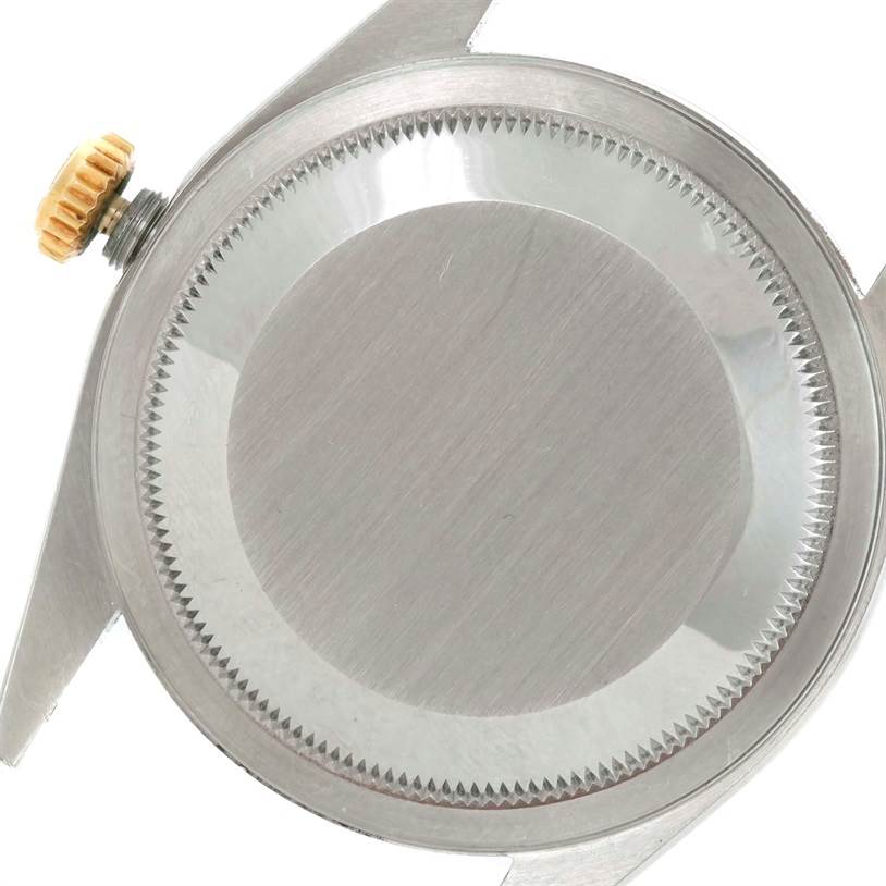 This image shows the back case and crown part of a Rolex Datejust 16233 Men's Steel and Gold (two tone) Champagne Dial 16233 Men's Steel and Gold (two tone) Champagne Dial watch viewed from the rear.