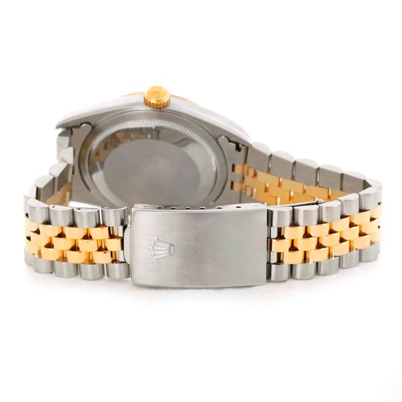 The image shows a rear view of the Rolex Datejust 16233 Men's Steel and Gold (two tone) Champagne Dial 16233 Men's Steel and Gold (two tone) Champagne Dial watch, focusing on the case back and two-tone bracelet with a clasp.