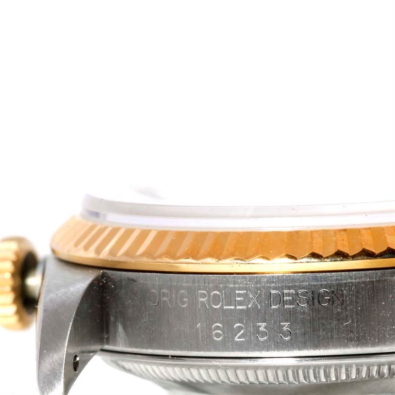 This image shows a close-up side view of the crown and bezel of a Rolex Datejust 16233 Men's Steel and Gold (two tone) Silver Dial 16233 Men's Steel and Gold (two tone) Silver Dial model, highlighting the model number engraved on the case.