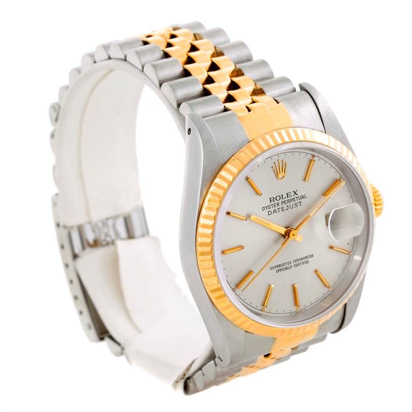 This Rolex Datejust 16233 Men's Steel and Gold (two tone) Silver Dial 16233 Men's Steel and Gold (two tone) Silver Dial model watch is shown at a three-quarter angle, highlighting the dial, bezel, and Jubilee bracelet.