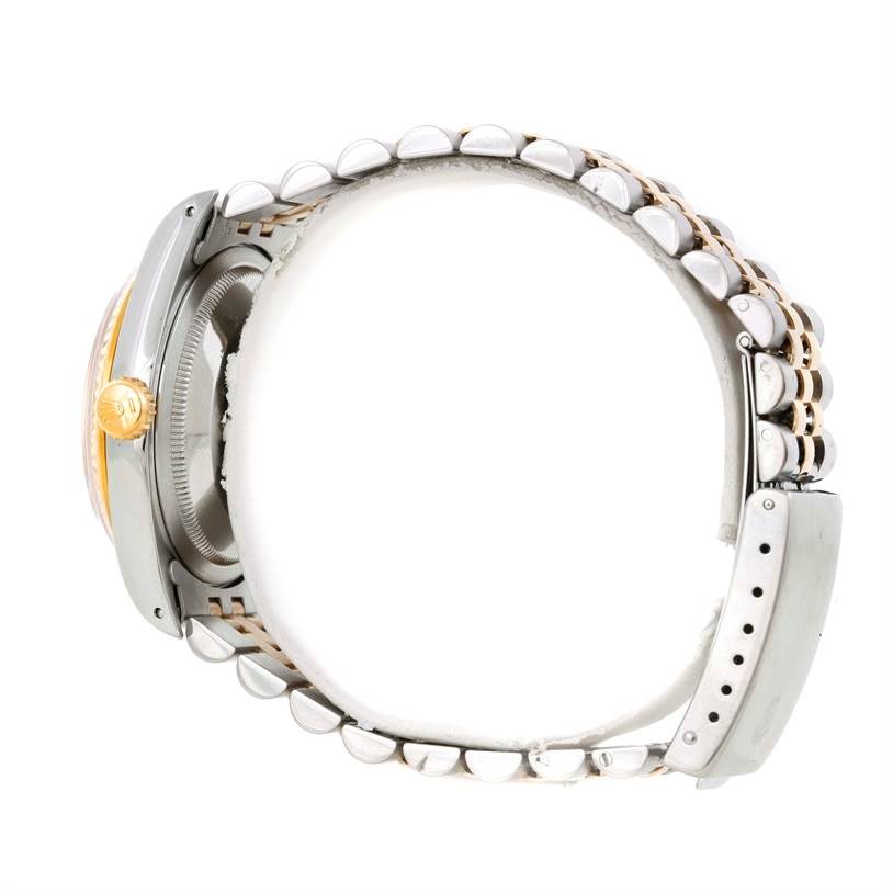 The image shows a side view of a Rolex Datejust 16233 Men's Steel and Gold (two tone) Silver Dial 16233 Men's Steel and Gold (two tone) Silver Dial watch, highlighting the crown, case, and bracelet links.