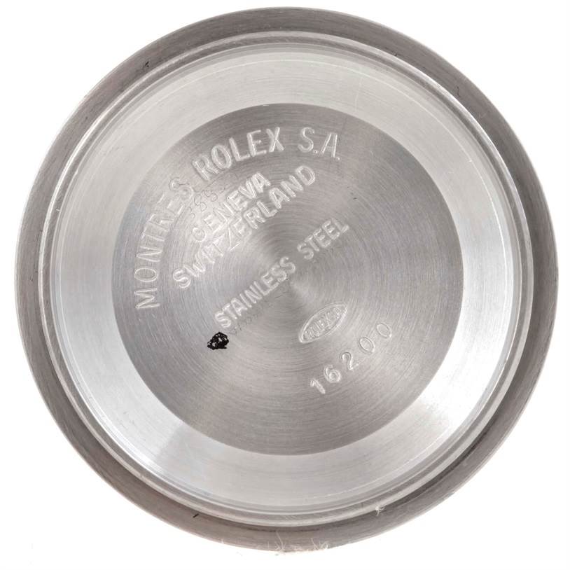 The image shows the case back of a stainless steel Rolex Datejust 16233 Men's Steel and Gold (two tone) Silver Dial 16233 Men's Steel and Gold (two tone) Silver Dial model 16200, viewed from the inside.