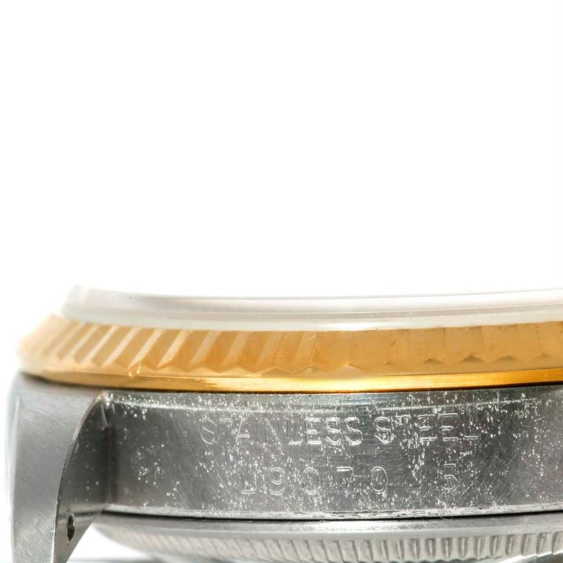 This image shows a close-up side view of the case and bezel of a Rolex Datejust 16233 Men's Steel and Gold (two tone) Champagne Dial 16233 Men's Steel and Gold (two tone) Champagne Dial watch.