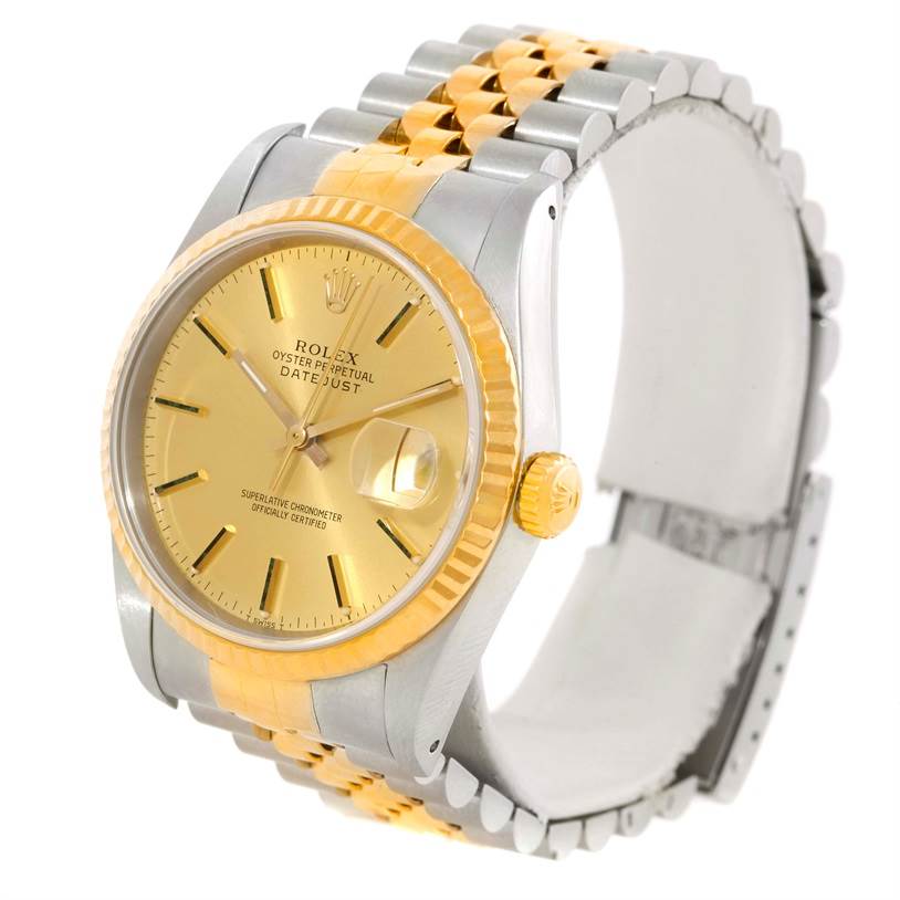 This image shows a Rolex Datejust 16233 Men's Steel and Gold (two tone) Champagne Dial 16233 Men's Steel and Gold (two tone) Champagne Dial watch at a slight angle, highlighting its gold face, fluted bezel, and two-tone bracelet.