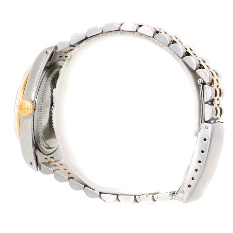 The image shows a side view of the Rolex Datejust 16233 Men's Steel and Gold (two tone) Champagne Dial 16233 Men's Steel and Gold (two tone) Champagne Dial watch, focusing on the crown, case, and bracelet.