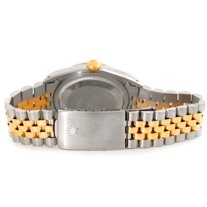 The image shows the back view of a Rolex Datejust 16233 Men's Steel and Gold (two tone) Champagne Dial 16233 Men's Steel and Gold (two tone) Champagne Dial watch, highlighting its caseback and Jubilee bracelet.