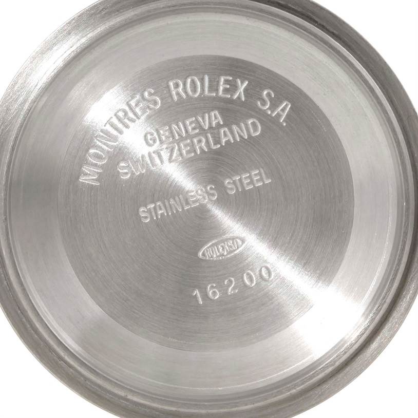 This image shows the inside case back of a Rolex Datejust 16233 Men's Steel and Gold (two tone) Black Dial 16233 Men's Steel and Gold (two tone) Black Dial watch, displaying the brand, model number, and material.