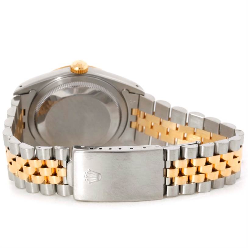 This image shows the back and bracelet clasp of the Rolex Datejust 16233 Men's Steel and Gold (two tone) Black Dial 16233 Men's Steel and Gold (two tone) Black Dial watch, featuring a two-tone metal band.