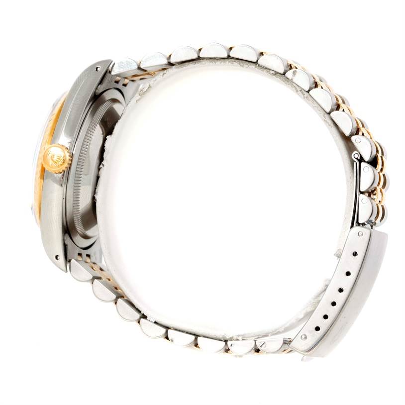 The image shows a side view of a Rolex Datejust 16233 Men's Steel and Gold (two tone) Black Dial 16233 Men's Steel and Gold (two tone) Black Dial watch, highlighting its case, crown, and bracelet.