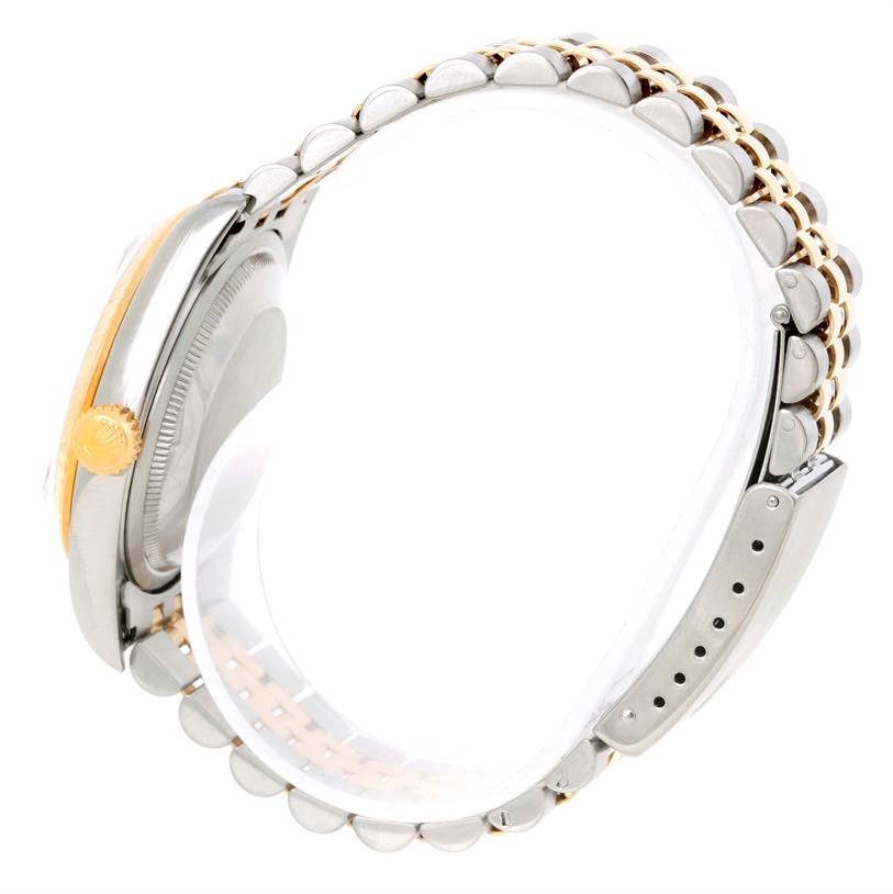 The image shows a side angle of a Rolex Datejust 16233 Men's Steel and Gold (two tone) Blue Dial 16233 Men's Steel and Gold (two tone) Blue Dial watch, focusing on its two-tone bracelet and crown.