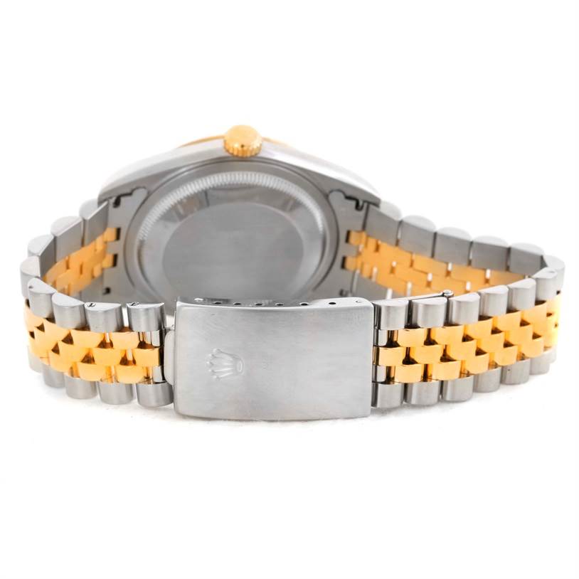 This image shows the back of the Rolex Datejust 16233 Men's Steel and Gold (two tone) Champagne Dial 16233 Men's Steel and Gold (two tone) Champagne Dial watch, focusing on the caseback and two-tone bracelet with the clasp.