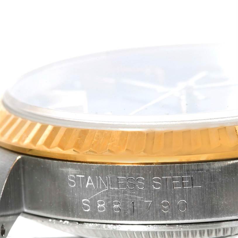 This image shows a close-up side view of a Rolex Datejust 16233 Men's Steel and Gold (two tone) Black Dial 16233 Men's Steel and Gold (two tone) Black Dial watch, focusing on the stainless steel case, fluted bezel, and partially visible crystal.