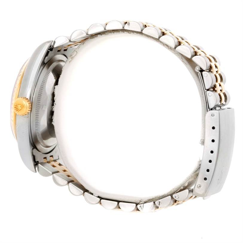 The image shows a side profile of a Rolex Datejust 16233 Men's Steel and Gold (two tone) Black Dial 16233 Men's Steel and Gold (two tone) Black Dial watch highlighting the crown and bracelet.