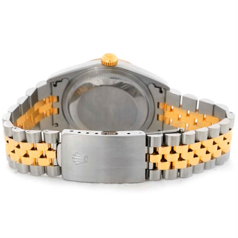 The image shows the back case and clasp of a Rolex Datejust 16233 Men's Steel and Gold (two tone) Black Dial 16233 Men's Steel and Gold (two tone) Black Dial watch with a two-tone bracelet.