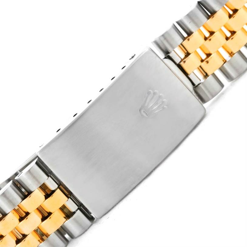 This image shows a close-up of the clasp and part of the bracelet of a Rolex Datejust 16233 Men's Steel and Gold (two tone) Black Dial 16233 Men's Steel and Gold (two tone) Black Dial watch.