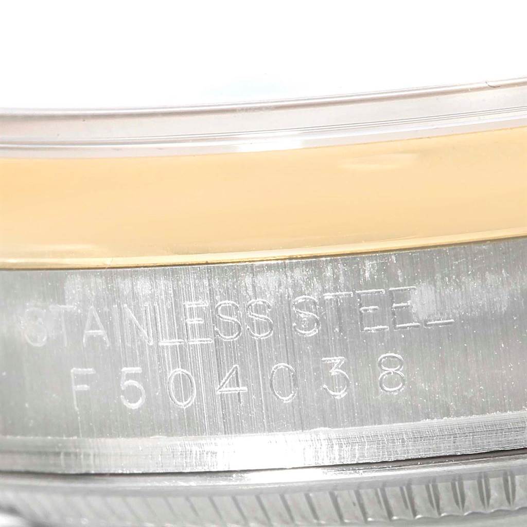 The image shows a close-up of the serial number and 'Stainless Steel' engraving on the edge of a Rolex Datejust 116203 Men's Stainless Steel Black Dial 116203 Men's Stainless Steel Black Dial watch.