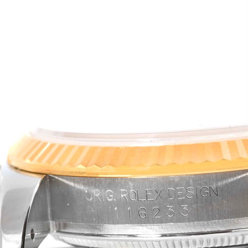 Side view of a Rolex Datejust 116233 Men's Stainless Steel White Dial 116233 Men's Stainless Steel White Dial showing the fluted bezel and engraved model number 116233.