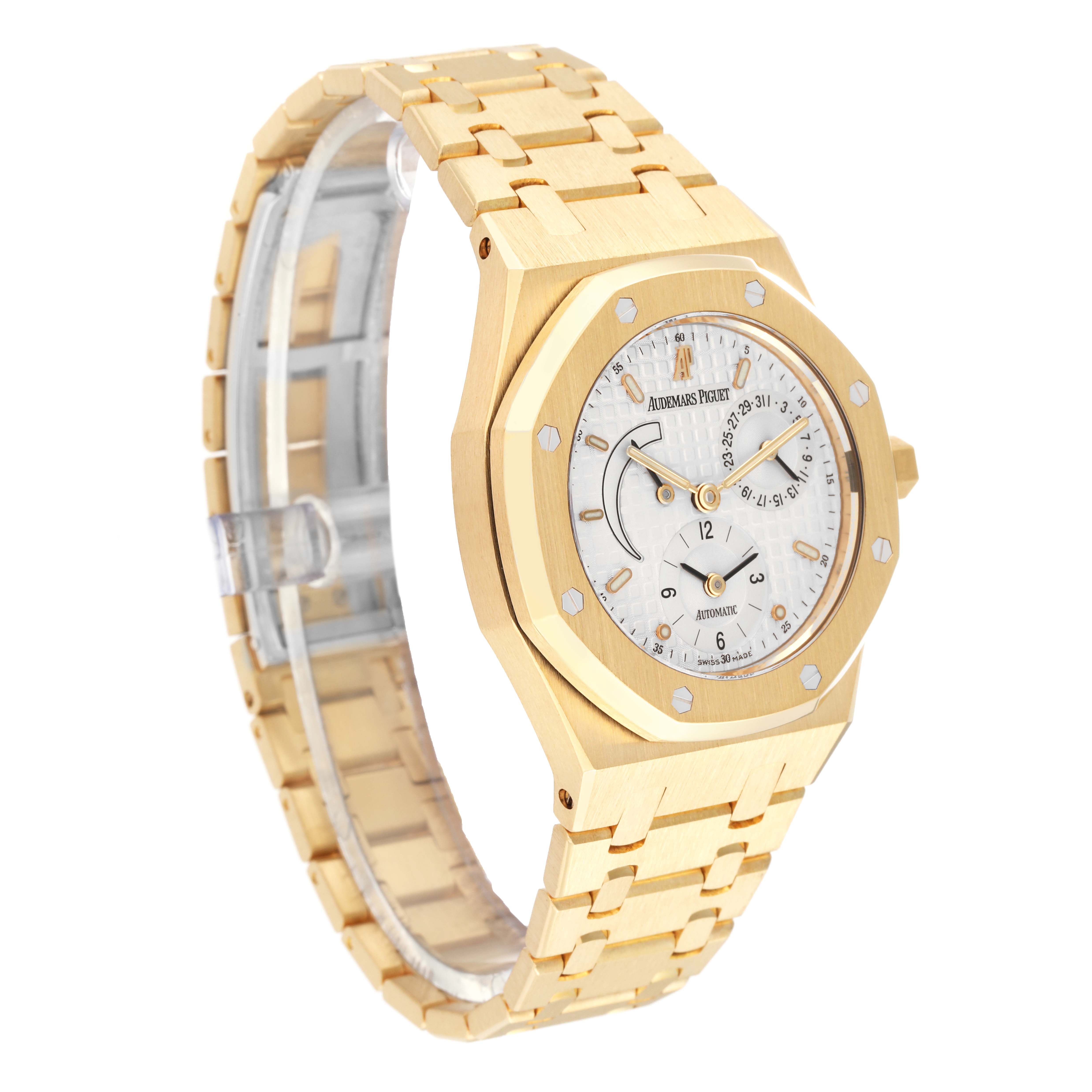 The image shows a gold Audemars Piguet Royal Oak 25730BA.OO.0789BA Men's Yellow Gold Silver Dial 25730BA.OO.0789BA Men's Yellow Gold Silver Dial watch at an angled side view, highlighting the watch face, bezel, and bracelet.