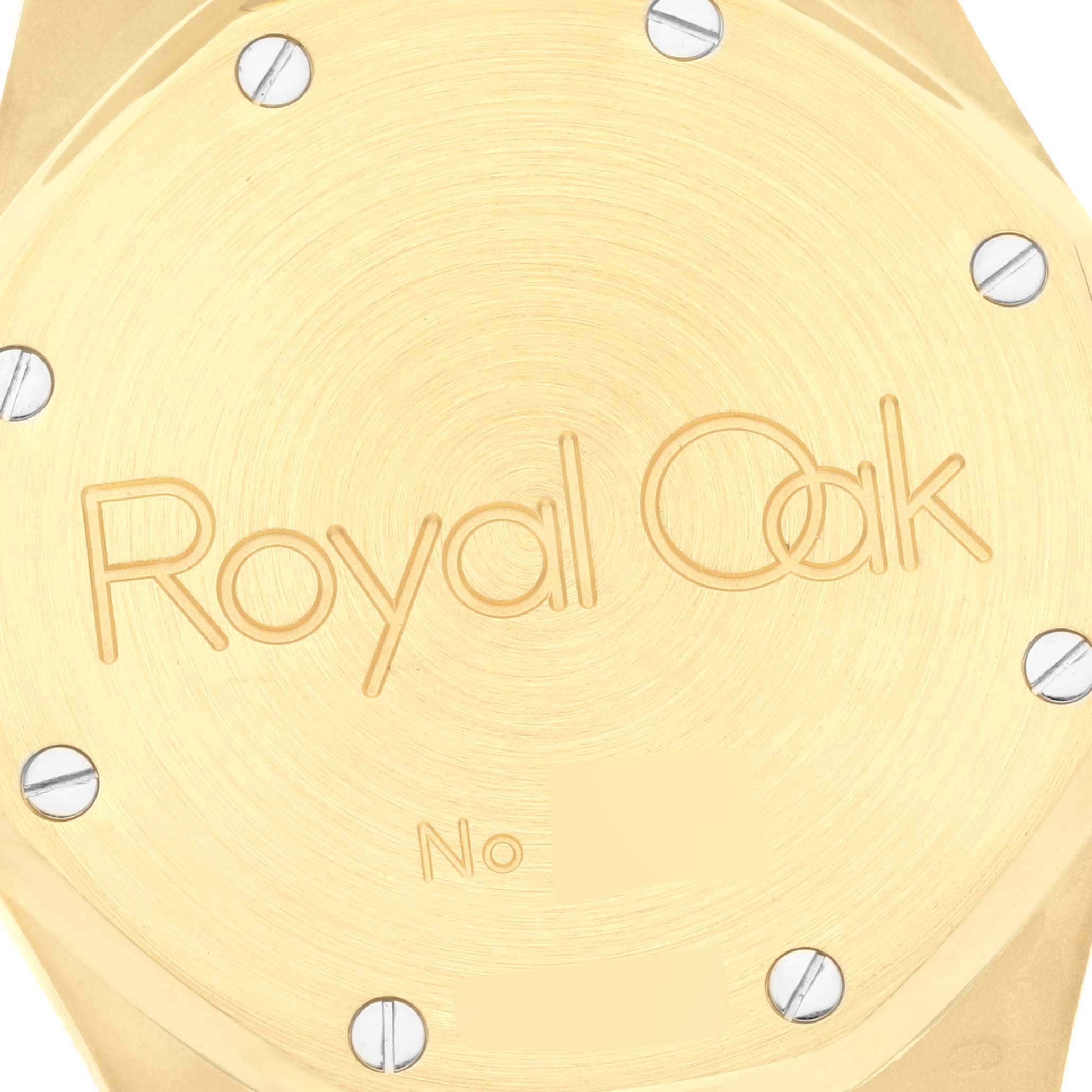 This image shows the case back of an Audemars Piguet Royal Oak 25730BA.OO.0789BA Men's Yellow Gold Silver Dial 25730BA.OO.0789BA Men's Yellow Gold Silver Dial watch, featuring engraved branding and screws.