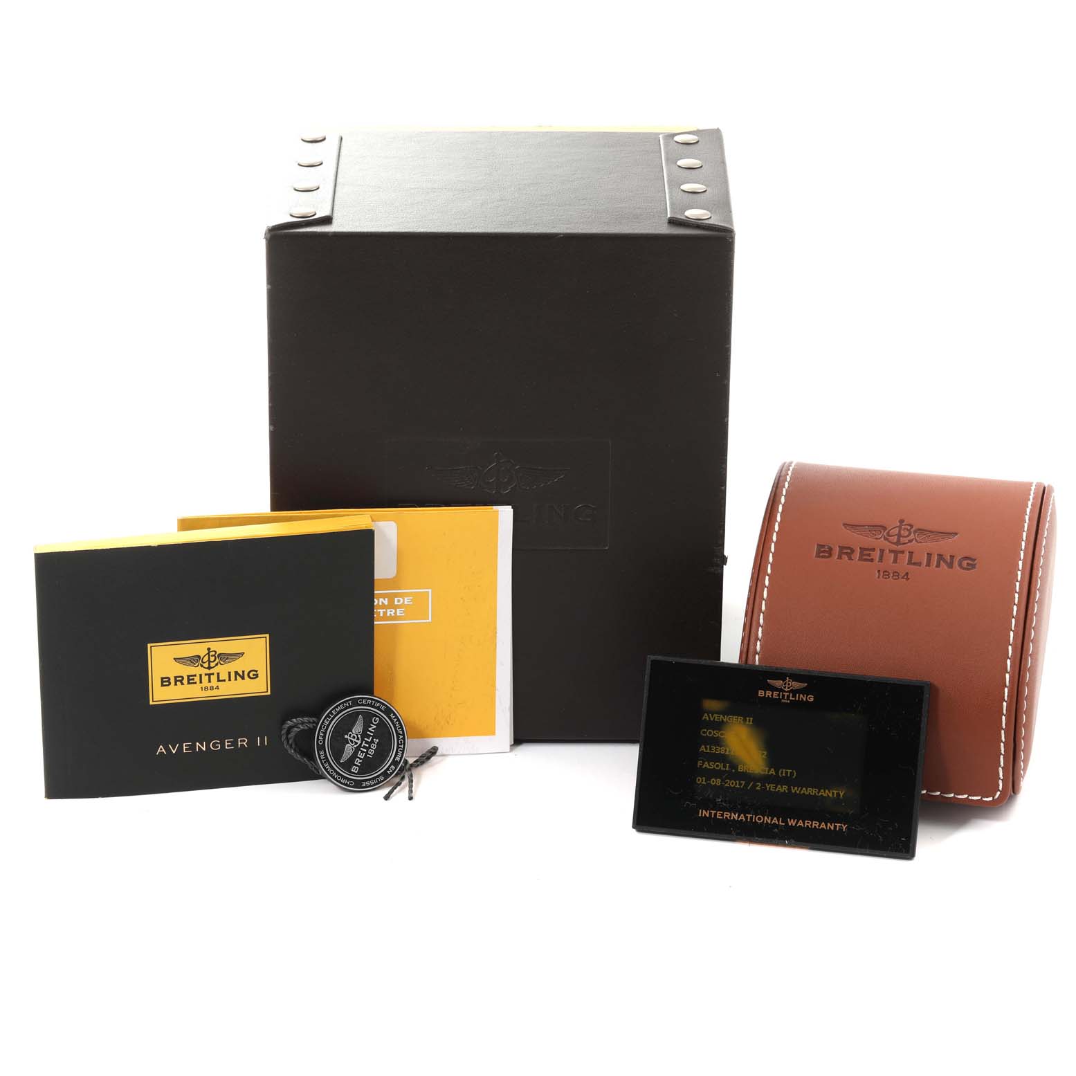 The image shows the Breitling Avenger A13381 Men's Stainless Steel Black Dial A13381 Men's Stainless Steel Black Dial II, its box, warranty card, manuals, and leather case from a slightly elevated angle.
