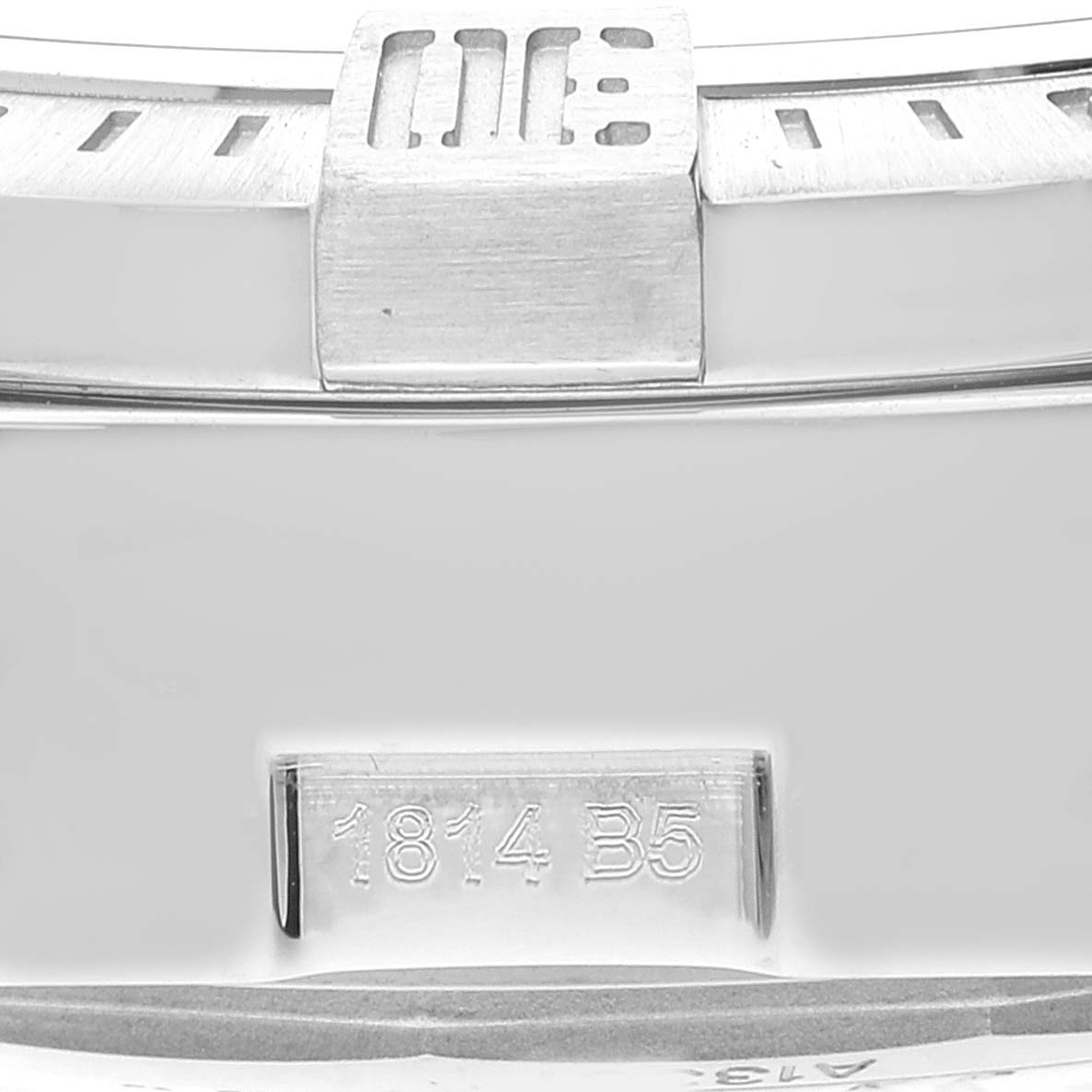 This is a close-up view of the serial number and part of the bezel on a Breitling Avenger A13381 Men's Stainless Steel White Dial A13381 Men's Stainless Steel White Dial watch.