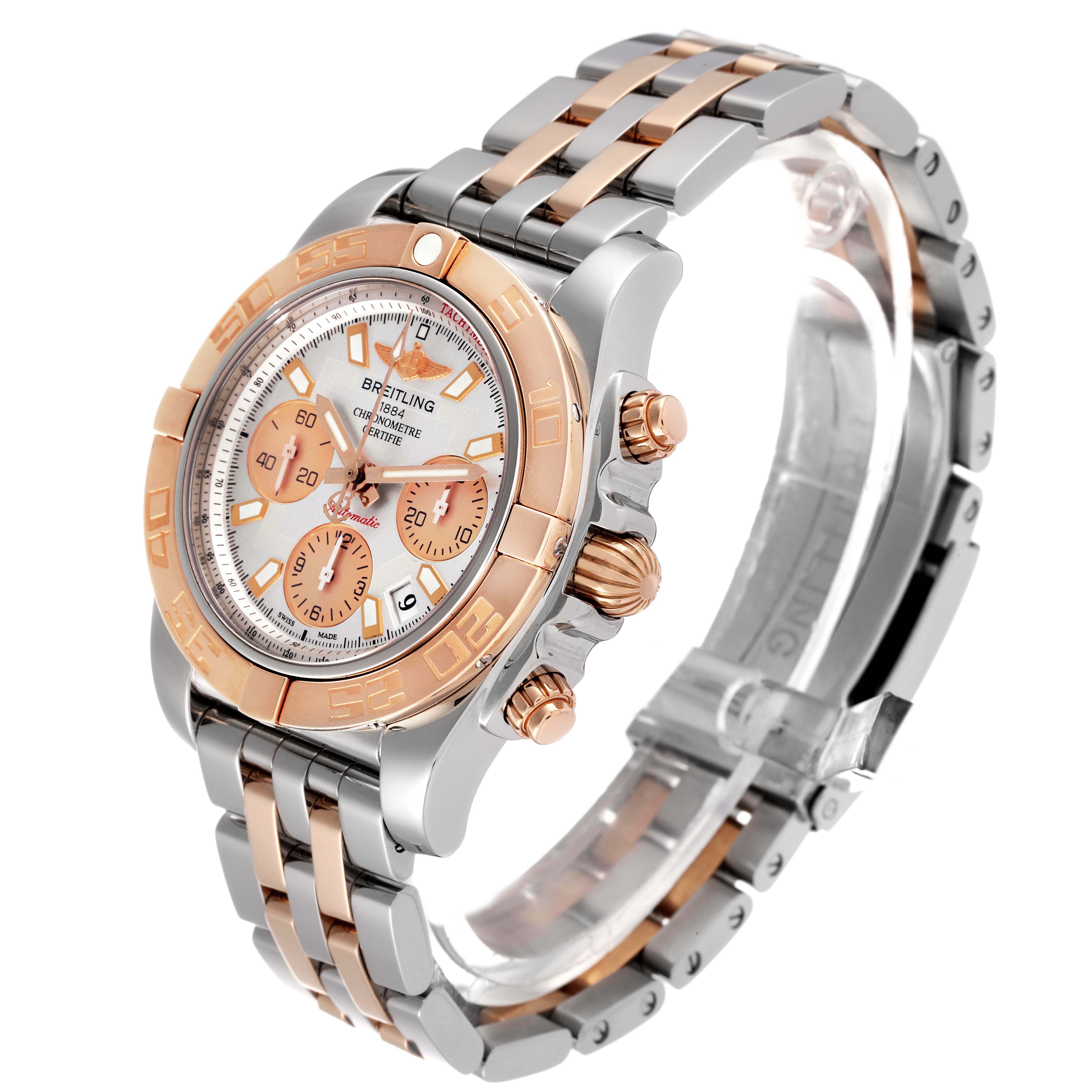 This image shows a Breitling Chronomat CB014012/G713 Men's Steel and Gold (two tone) Silver Dial CB014012/G713 Men's Steel and Gold (two tone) Silver Dial watch at a three-quarter angle, displaying its bezel, dial, chronograph, case, and metal band.