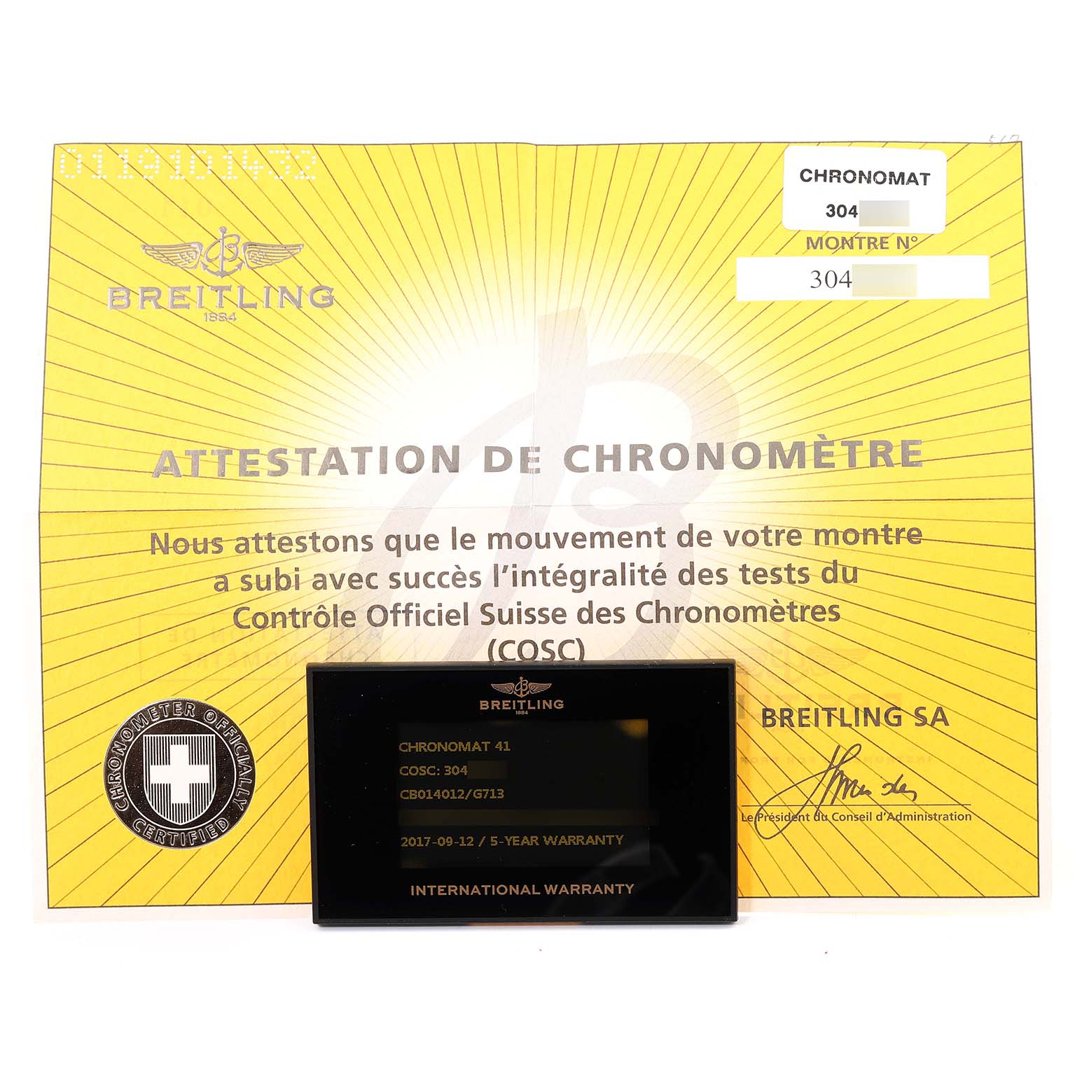 The image shows the Breitling Chronomat CB014012/G713 Men's Steel and Gold (two tone) Silver Dial CB014012/G713 Men's Steel and Gold (two tone) Silver Dial model's certificate and international warranty card laid flat.