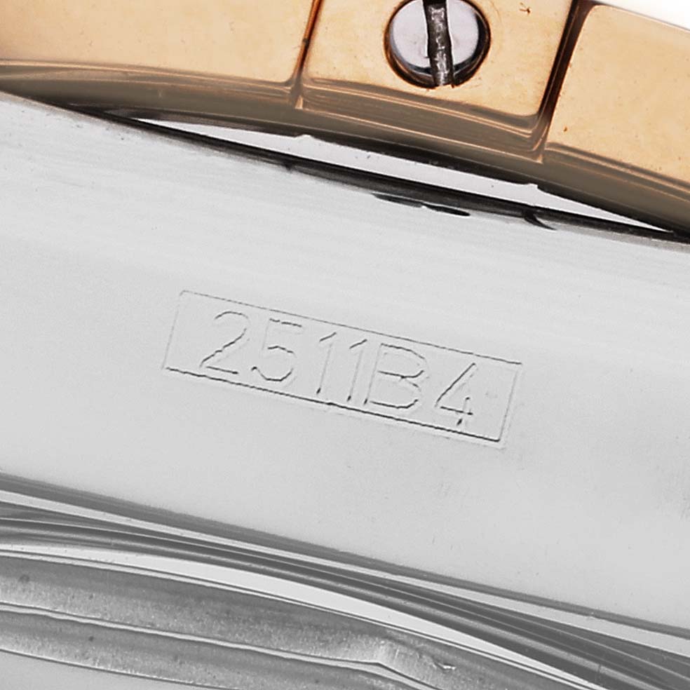 The image shows a close-up of the band and serial number of a Breitling Chronomat CB014012/G713 Men's Steel and Gold (two tone) Silver Dial CB014012/G713 Men's Steel and Gold (two tone) Silver Dial watch.