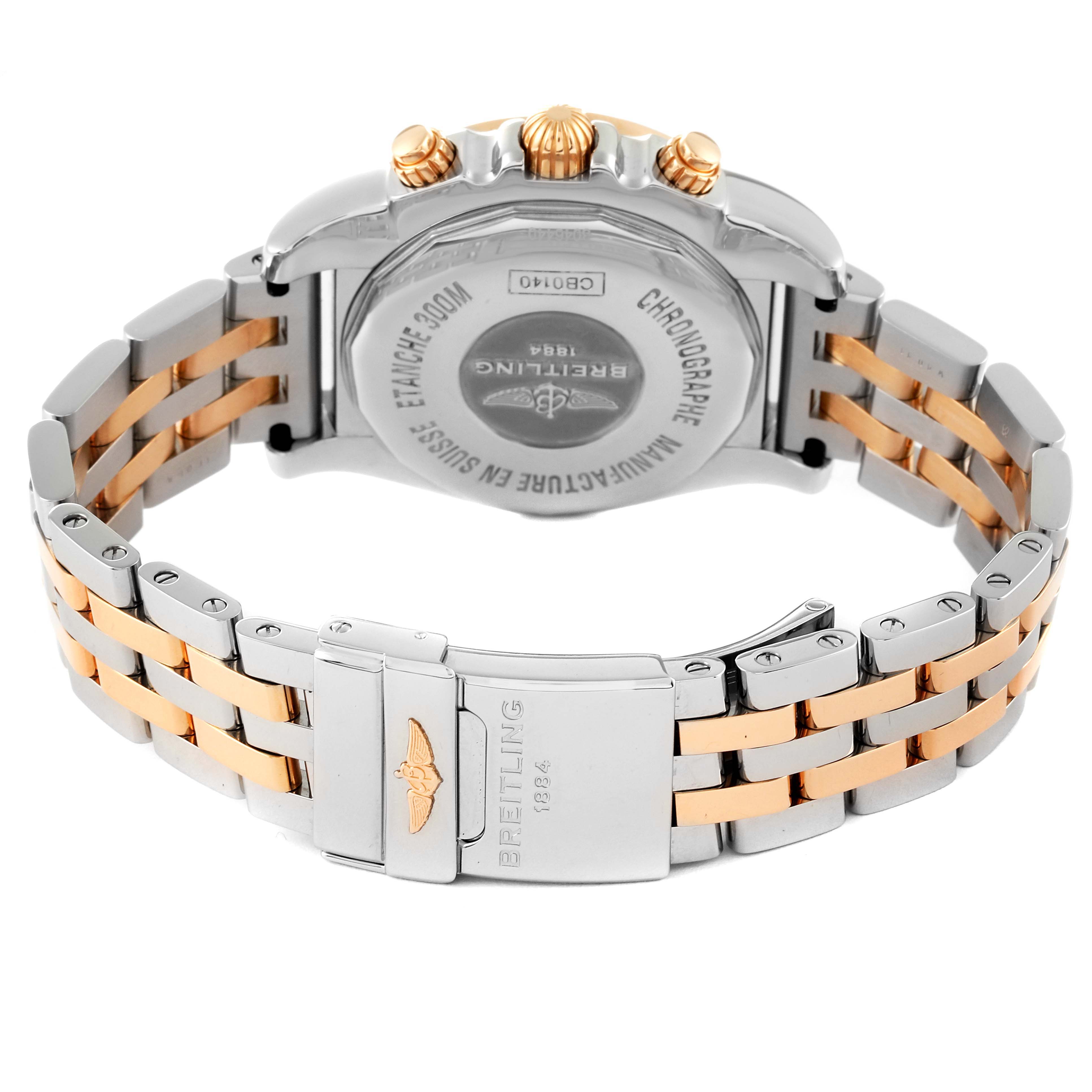The image shows the back view of a Breitling Chronomat CB014012/G713 Men's Steel and Gold (two tone) Silver Dial CB014012/G713 Men's Steel and Gold (two tone) Silver Dial watch, including its case back and metal bracelet with clasp.