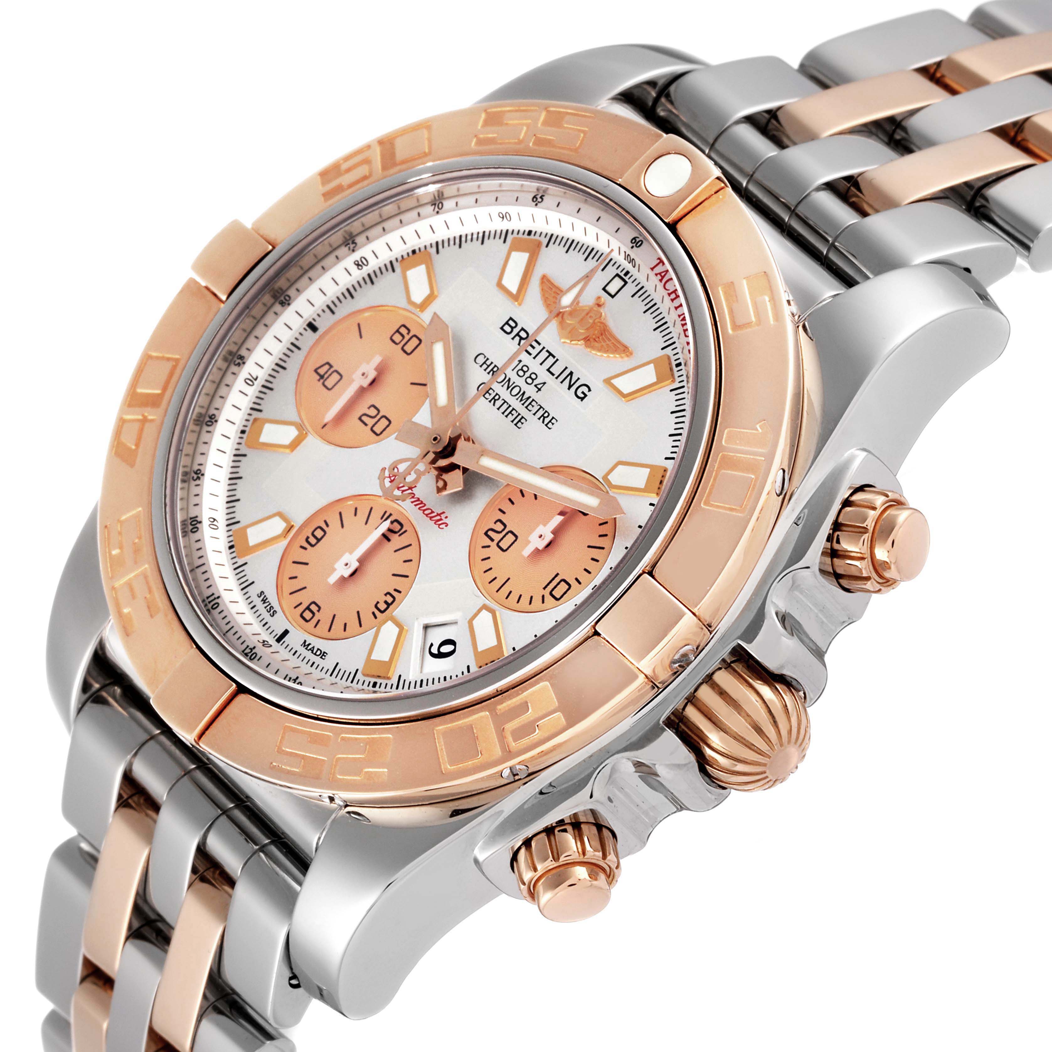 The Breitling Chronomat CB014012/G713 Men's Steel and Gold (two tone) Silver Dial CB014012/G713 Men's Steel and Gold (two tone) Silver Dial watch is shown at an oblique angle, displaying its face, bezel, crown, and bracelet.